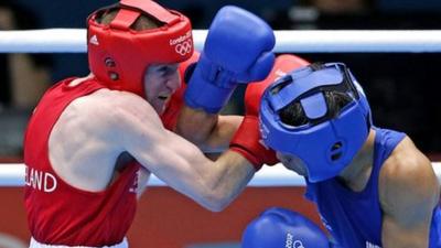 Paddy Barnes and Devandro Singh Laishram exhange punches