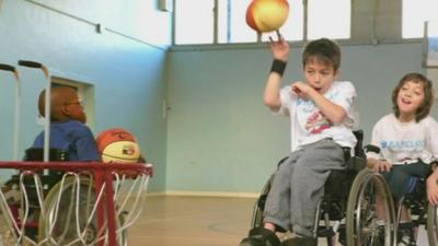 Archie playing wheelchair basketball