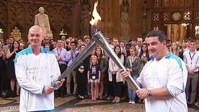 Roy Kerwin and Alan Richardson carry Paralympic flame