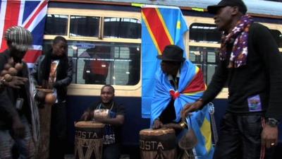 Musicians in front of the Africa Express train