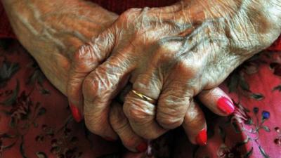 An elderly woman's hands