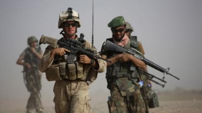 US and Afghan soldiers on a joint patrol (archive image)