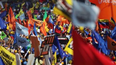 Henrique Capriles surrounded by flags