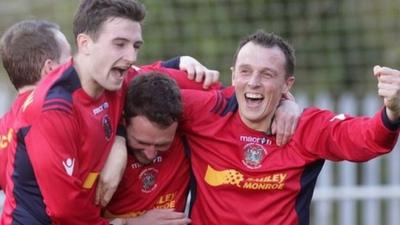 Lisburn Distillery players celebrate victory over Donegal Celtic