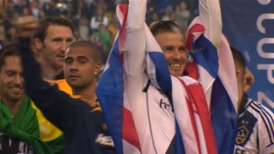 David Beckham holding trophy