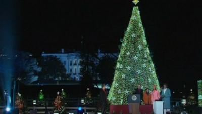 Obamas light Christmas tree in front of White House