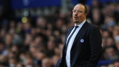 Rafa Benitez watches his team beat Everton 2-1