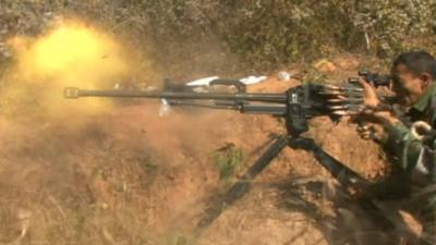 Burmese government soldier firing gun