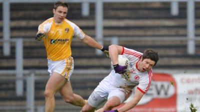 Sean Cavanagh battles with Tony Scullion in Tyrone's match against Antrim earlier this month