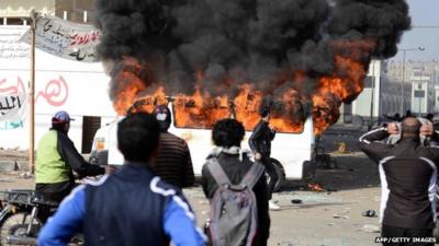 Burning minibus outside Port Said prison