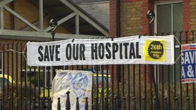 Banner proclaiming 'Save our hospital' outside Lewisham A&E
