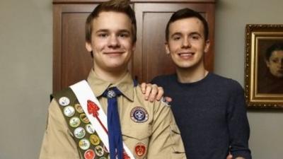 Pascal Tessier, 16, center and his brother Lucien Tessier, 20, pose for a portrait