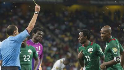 Referee Slim Jdidi dismisses Burkina Faso's Jonathan Pitroipa (number 11) in Wednesday's Africa Cup of Nations semi-final against Ghana.