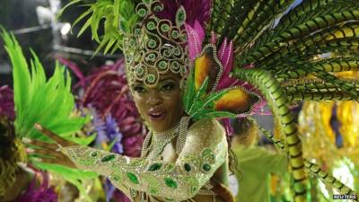 A reveller participates during the annual carnival parade in Rio de Janeiro's Sambadrome