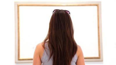 Model looking at a painting