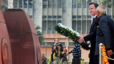 David Cameron placing a wreath at the memorial to the Amritsar massacre