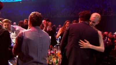 Carey Mulligan gives Marcus Mumford a hug
