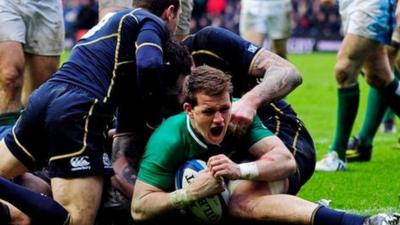 Craig Gilroy scores a try for Ireland against Scotland