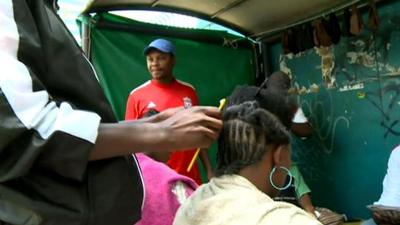 A woman having her hair styled