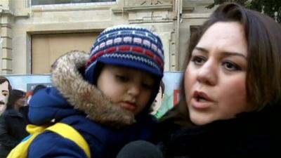 An Azeri woman with her child