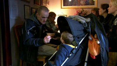 Man feeding baby