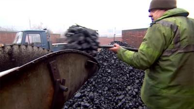 Man loading coal