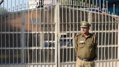 A guard outside Tihar jail