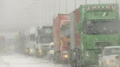 Traffic on a motorway during snowfall