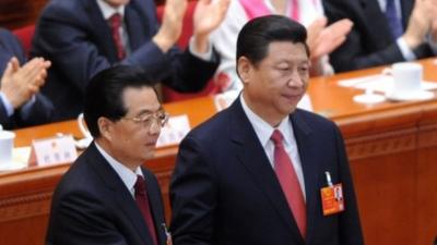 Chinese President Xi Jinping (R) with former president Hu Jintao (L)