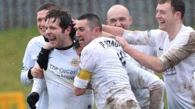 Donegal Celtic players celebrate victory over Lisburn Distillery