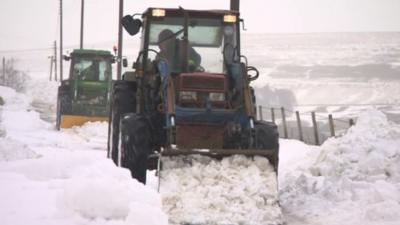 Tractors in snow