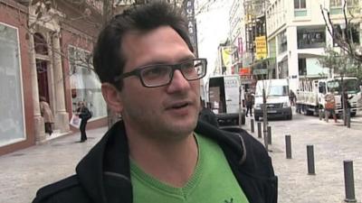 Greek man who taken paycut