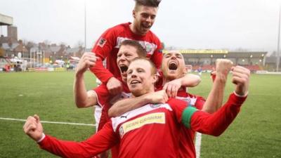 Cliftonville players celebrate winning the Irish Premiership