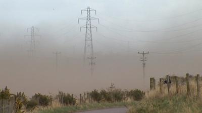 Sandstorm in a field