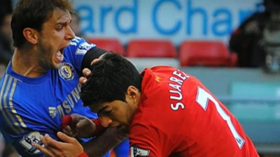 Liverpool's Luis Suarez bites Chelsea's Branislav Ivanovic