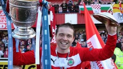 Chris Scannell celebrates with the Gibson Cup