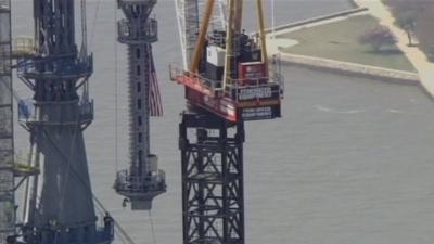 Spire hoisted to top of One World Trade Center