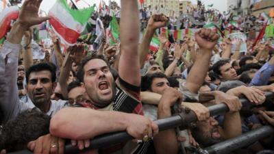 Supports of Iranian President Mahmoud Ahmadinejad at a rally in Tehran 2009