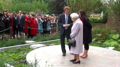 The Queen and Prince Harry at a Chelsea Flower Show garden