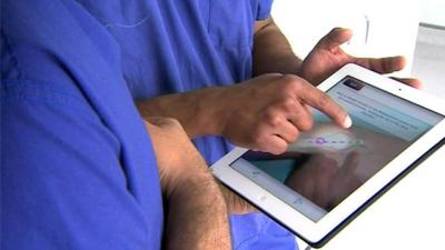 Surgeons with an ipad