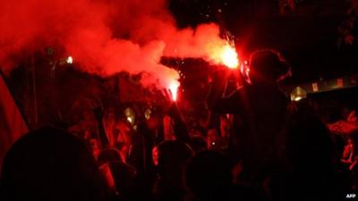 Protesters with flares