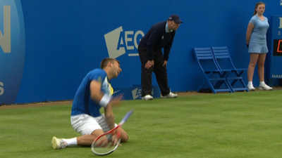 Dan Evans falls at Queen's