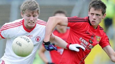 Tyrone's Padraig McGirr with Pat Havern of Down