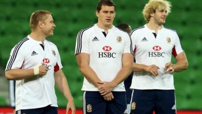 Tom Court with fellow Lions players Ian Evans and Richie Gray in Melbourne