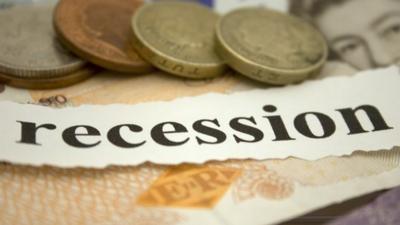 Money and newspaper cuttings. debt, credit , credit cards, recession, coins