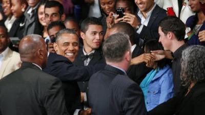 U.S. President Barack Obama greets the public as he arrives to deliver remarks and takes questions at a town hall meeting with young African leaders at the University of Johannesburg Soweto campus Saturday June 29