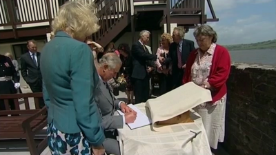 Prince Charles and the Cornwall at the boathouse