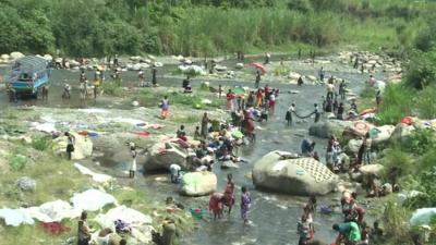 People in a river