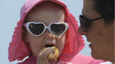 Enjoying an ice-cream on Castle Hill beach in Tenby