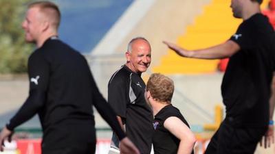 Tommy Breslin chats to Liam Boyce during Cliftonville training on Monday